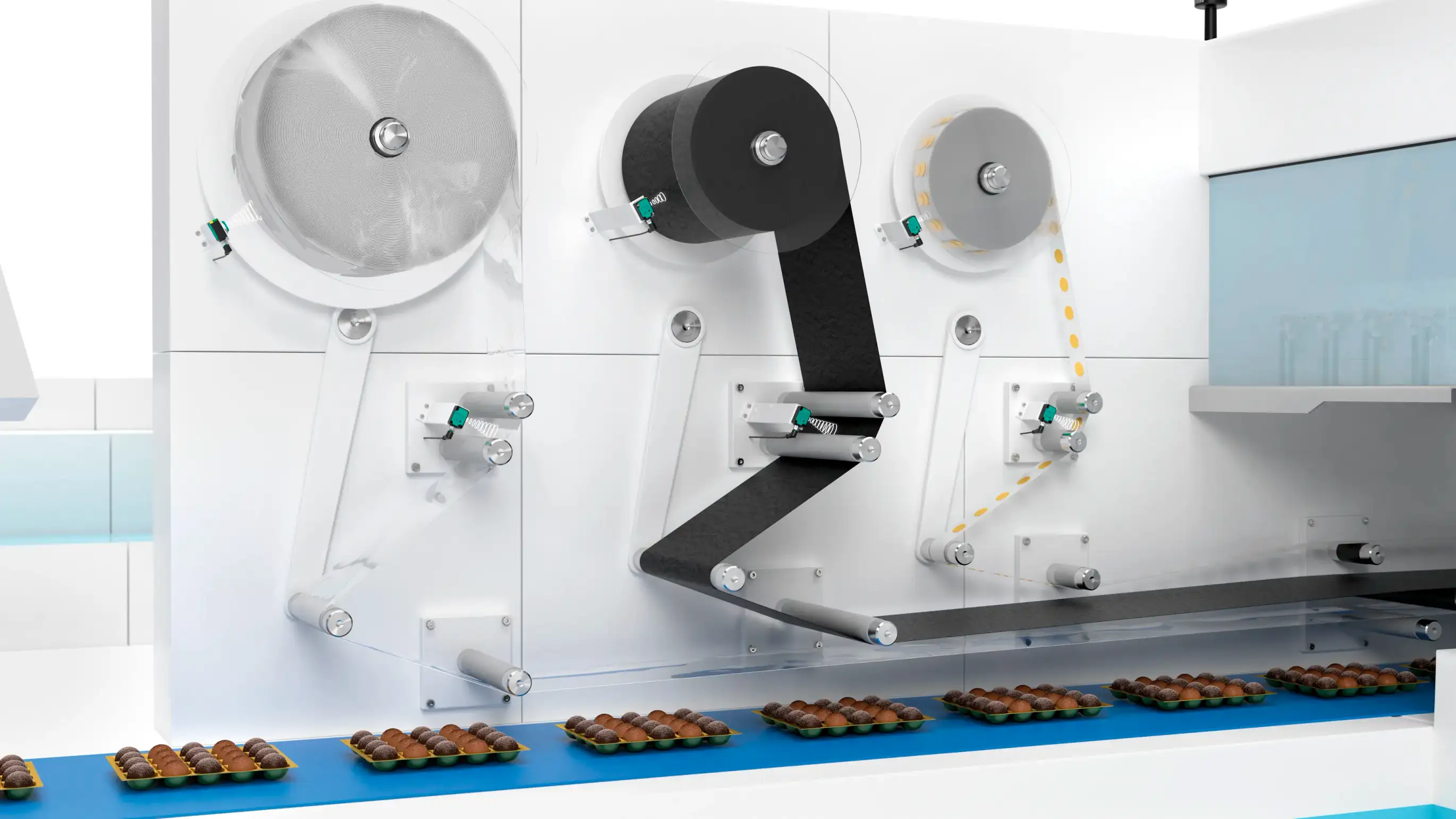 Materials fed from rolls and guided through numerous rollers