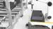 The 2-D universal vision sensor VOS2000 mounted on an AGV with a robot arm