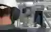 Mobile worker in an industrial environment holding a tablet in his hand