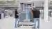 two persons in front of a finished engineered solution during the factory acceptance test (FAT)