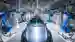 automotive production line with several robotic arms on both sides